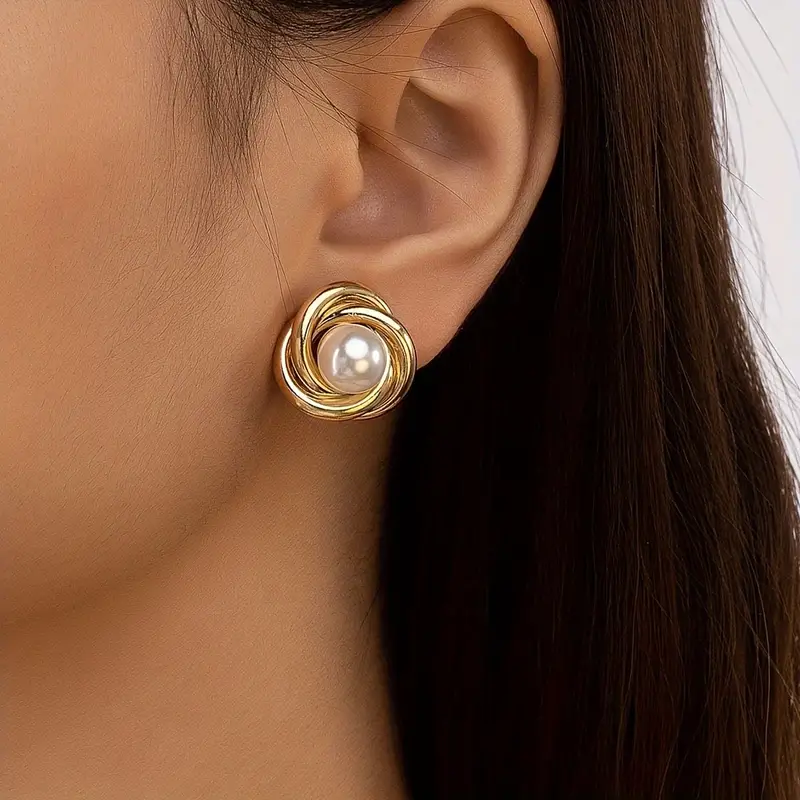 Elegant gold earrings with pearls